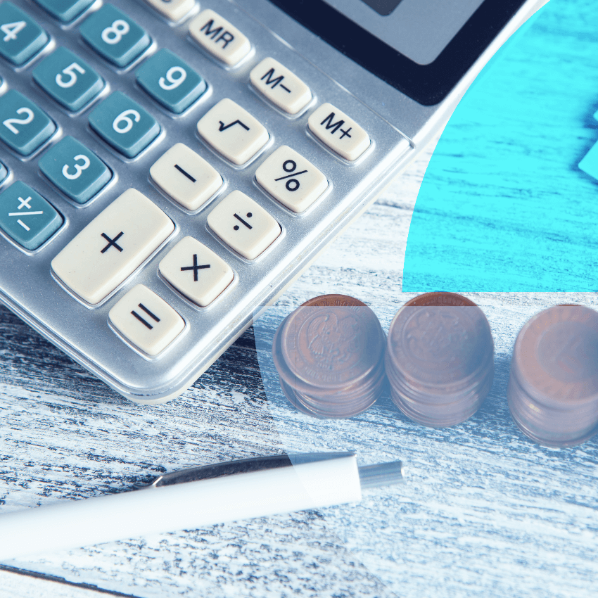 a calculator, some paper, a pen, and money on a desk